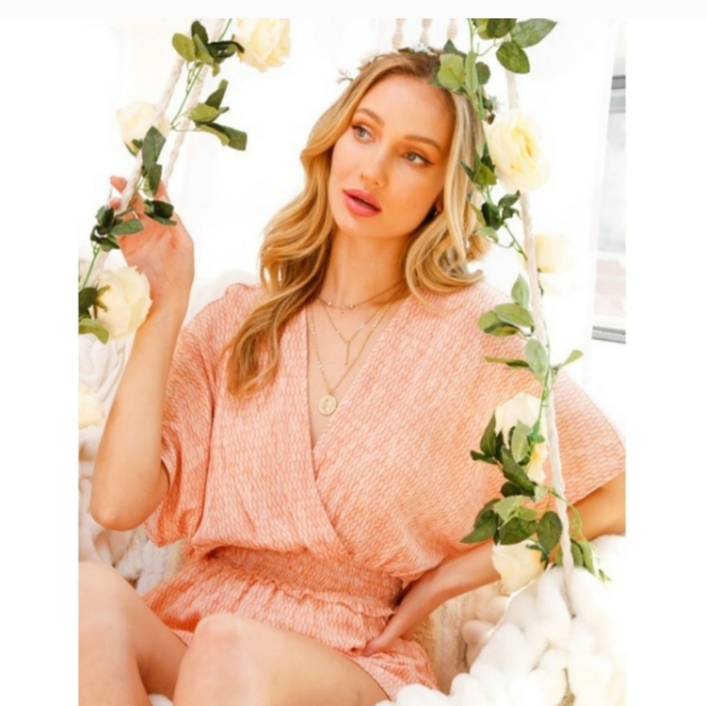 SMOCKED PEPLUM TOP